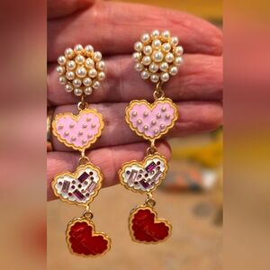 Pearl and enamel dangling earrings.